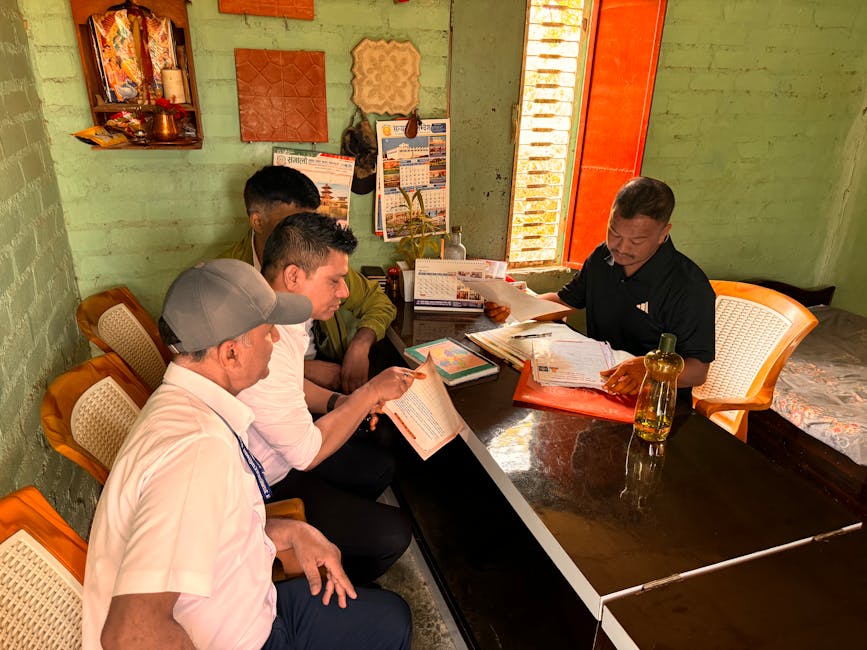 Men working together in a cozy office space with documents and calendars visible.